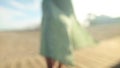 Close-up of foot and toes in the sand of a young girl in slow motion. Wiggles toes on a sandy beach on a sunny day