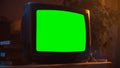 Close Up Footage of a Dated TV Set with Green Screen Mock Up Chroma Key Template Display. Nostalgic