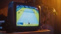 Close Up Footage of a Dated TV Set Screen with Live Sports Tennis Match Broadcast. Two Athletic