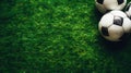 Close up of football balls on green grass background, top view. Copy space. Sport advertising concept. Generative AI Royalty Free Stock Photo