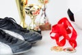 Close up of football boots, cups and medals Royalty Free Stock Photo
