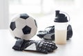 Close up of football boots, gloves and bottle Royalty Free Stock Photo