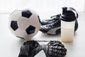 Close up of football boots, gloves and bottle Royalty Free Stock Photo