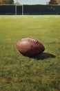 close-up of a football on a grassy field with yard lines Royalty Free Stock Photo