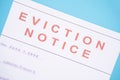 Close up of Foreclosed or eviction notice with blurred details at hose.