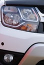 a close-up of the foreground of a car headlight and part of the bonnet Royalty Free Stock Photo