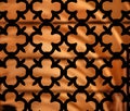 A close-up of a forged iron lattice.