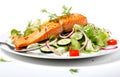 Close-up of fork with food on it: delicious fillet salmon, cucumber, onion, green salad isolated on white background