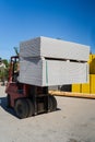 Close up on fork lifter carry the pile of drywall gypsum boards on the palett Royalty Free Stock Photo