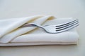 Close up fork on white napkin in restaurant Royalty Free Stock Photo