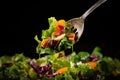 close-up of a forkful of mixed salad greens Royalty Free Stock Photo
