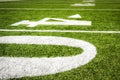 Close Up on the forty yard line on american football field with artificial turf