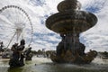 Close-up of a fountain with sculptures of gods and empty ferris