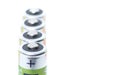 Close-up four AA batteries plus terminals and white background Royalty Free Stock Photo