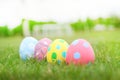 Close up four eggs pastel line in the grass background in ester day. Royalty Free Stock Photo