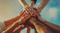 Illustration of teamwork and unity with four hands joined together in solidarity. AIG53M Royalty Free Stock Photo