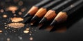A close up of four luxury sharpened black graphite pencils with golden sparkles on a dark background, emphasizing Royalty Free Stock Photo
