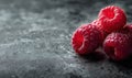 A close up of four raspberries on a counter Royalty Free Stock Photo