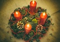 Close up of four red candles burning on advent wreath on evening. Merry Christmas, Advent crown decoration, 4th sunday, Christmas Royalty Free Stock Photo