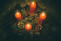 Close up of four red candles burning on advent wreath on evening. Merry Christmas, Advent crown decoration, 4th sunday, Christmas Royalty Free Stock Photo