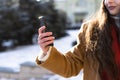 close-up of fragile female hands holding a phone while walking