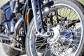 Fragment of chromed shiny wheel of old classic motorbike Royalty Free Stock Photo