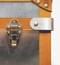 Close-up fragment of locks and fasteners on the vintage leather and metal suitcase brown, vertical image Royalty Free Stock Photo