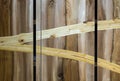 Close up of fragment of wooden wardrobe made of different kinds