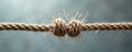 Close-up of frayed rope knot about to break under tension. Symbolizes stress, breaking point, and fragility. Shows strain and Royalty Free Stock Photo