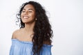 Close-up free and relieved happy attractive, encouraged african american curly-haired woman with tattoos in blue blouse