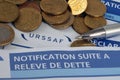 Close-up of French documents linked to tax documents with cash