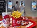 Close-up of french fries, drink and burger on a tray at Wendys fast food restaurant