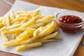 Close-up, French fries with ketchup on the table Royalty Free Stock Photo