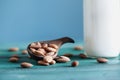 Close up of Fresh Almonds with Bottled White Almond Milk Royalty Free Stock Photo