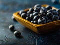 Close-up. Fresh appetizing blueberries in a bowl on a blue background. Delicious healthy berries, agriculture and forestry, Royalty Free Stock Photo