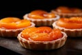 Close-up of fresh apricot tartelettes dessert