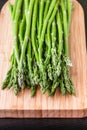 Close up of fresh asparagus on wooden board. Royalty Free Stock Photo