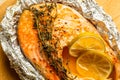 Close up of the fresh baked fish in foil with herbs and lime Royalty Free Stock Photo