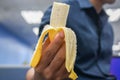 Close up fresh banana peel in man hand for eat