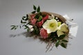 Close-up fresh bouquet of hippeastrum, allium, carnation, ruscus, genista, cotton on a gray background, selective focus