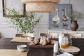 Close-up of fresh bread and milk on a table in a cozy dining room interior on a countryside