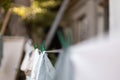 Close up of fresh clean white towels drying on washing line in outdoor. Drying clothes and weather forecast concept Royalty Free Stock Photo