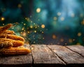 Close-up of fresh corn cobs on a rustic wooden surface with glowing light particles in the background Royalty Free Stock Photo