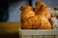 Close-up of fresh croissants, powdered sugar and puffs