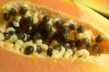 Close up of Fresh cut papaya halves with black seeds