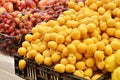Close up of fresh dates and grapes on market stand Royalty Free Stock Photo