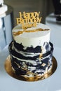 Close up of fresh delicious birthday cake with words candles on gold plate Royalty Free Stock Photo