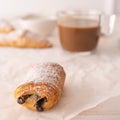 Fresh flaky French pain au chocolat with coffee breakfast food Royalty Free Stock Photo