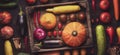 close-up of fresh fruits and vegetables in a box on a flatline wooden table. assorted autumn harvest details