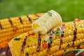 Close-up of fresh grilled corn with curl of butter